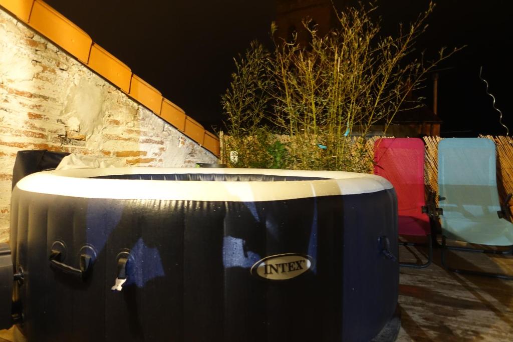 a blue drum with the nike logo on it at Maison Small Luxury ( planxa,suite,solarium,jacuzzi,pas de vis à vis) in Argelès-sur-Mer