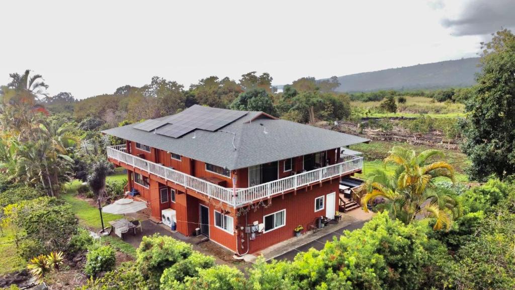 an aerial view of a house with solar panels on it at Coffee Garden in Captain Cook