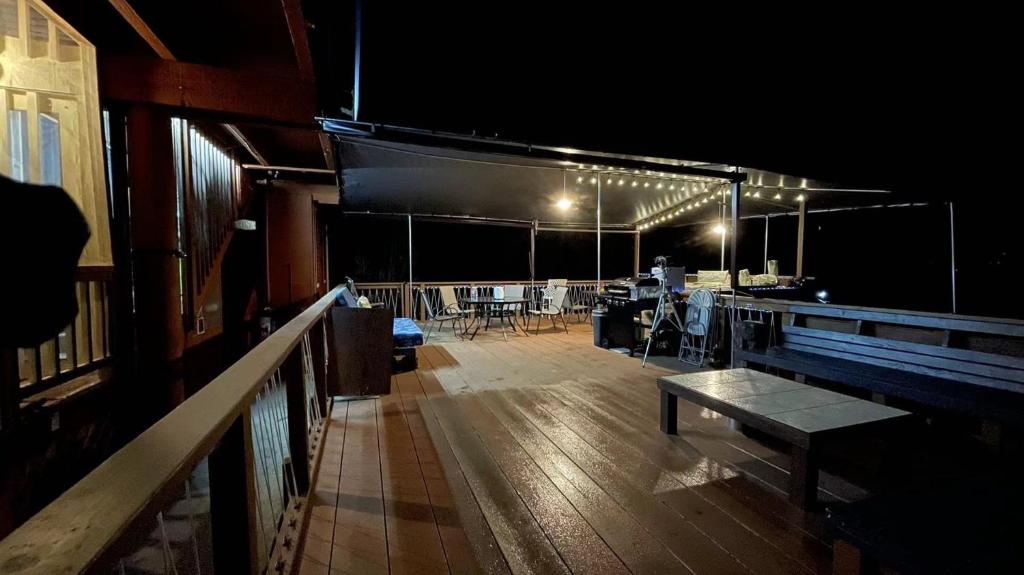 an empty room with a table and chairs on a boat at Coffee Garden in Captain Cook