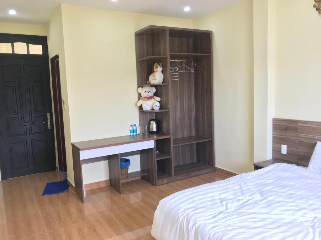 Postel nebo postele na pokoji v ubytování Ngoc Tran Hotel