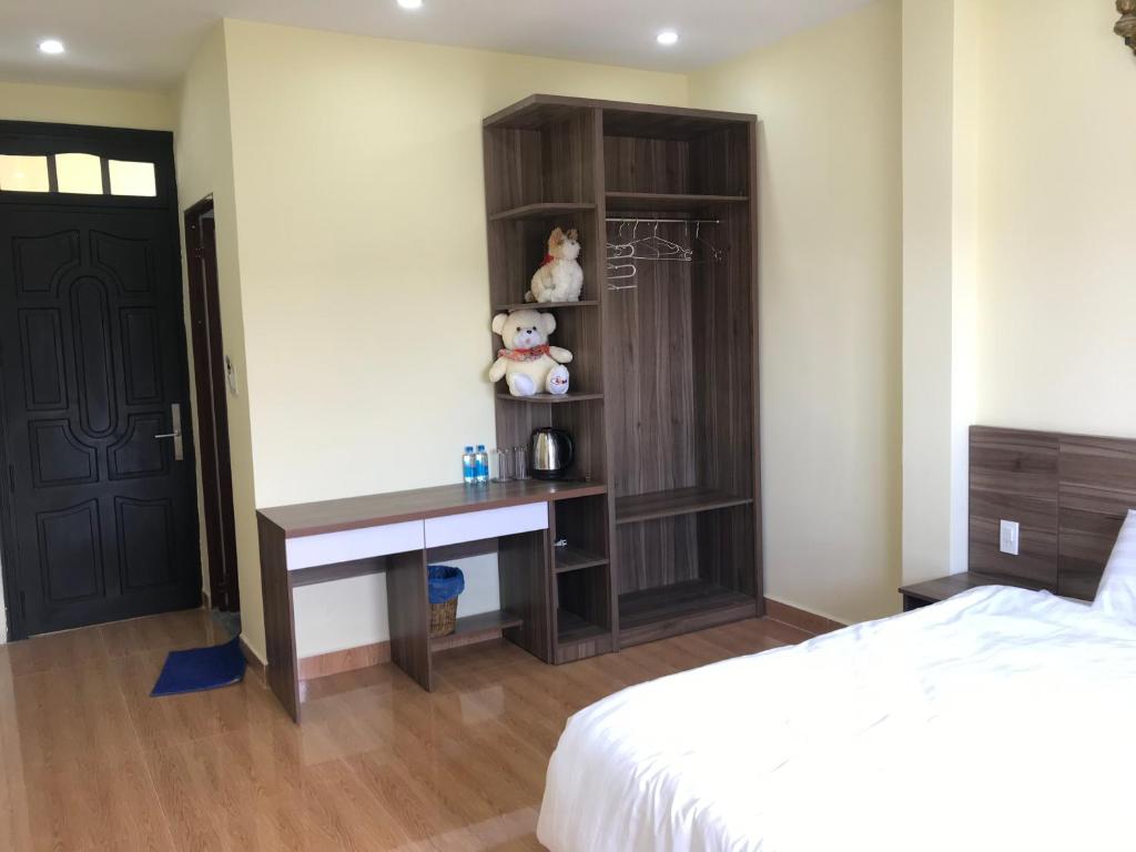 Postel nebo postele na pokoji v ubytování Ngoc Tran Hotel