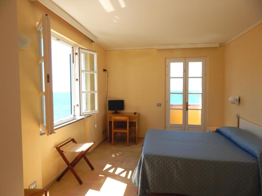 Postel nebo postele na pokoji v ubytování Appartamenti - Villa Mare