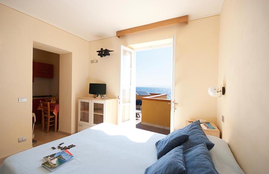 Postel nebo postele na pokoji v ubytování Appartamenti - Villa Mare