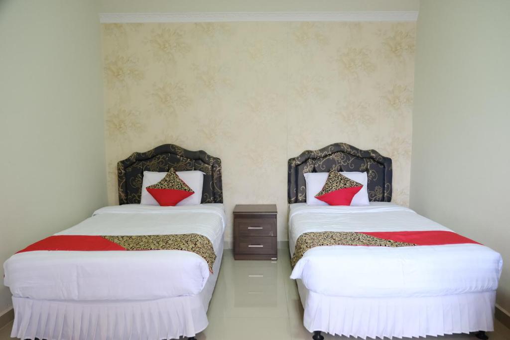 Postel nebo postele na pokoji v ubytování Joyful Hotel