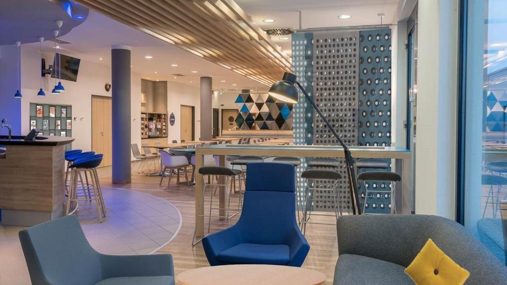 Posezení v ubytování Holiday Inn Express München Messe by IHG