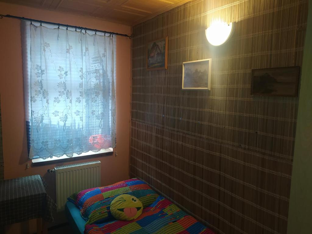 Postel nebo postele na pokoji v ubytování Dřevěnka
