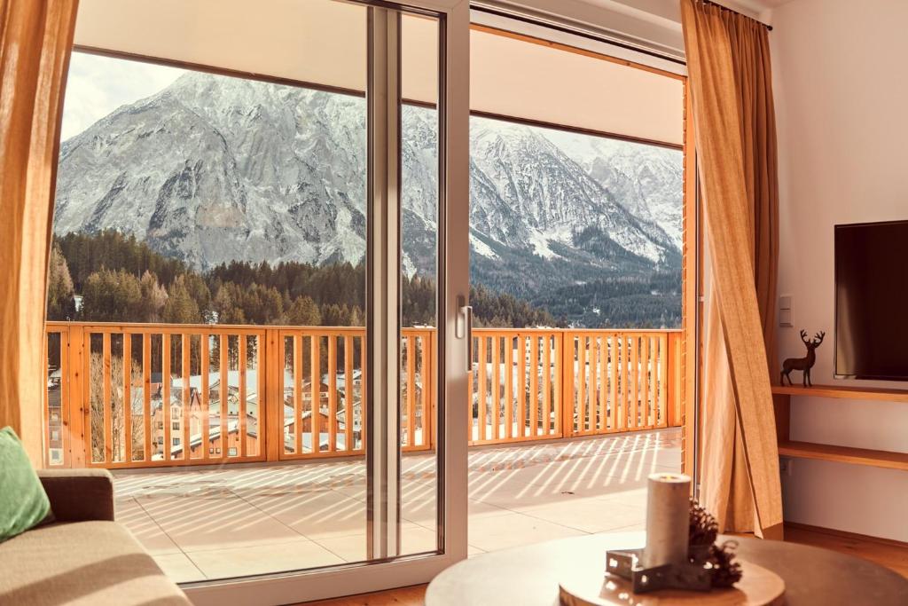 a living room with a view of a mountain at Adler Lodge D2 by AA Holiday Homes in Tauplitz