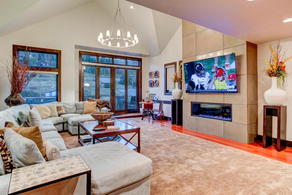 a living room with a couch and a tv at 605 Deer Valley Drive in Park City