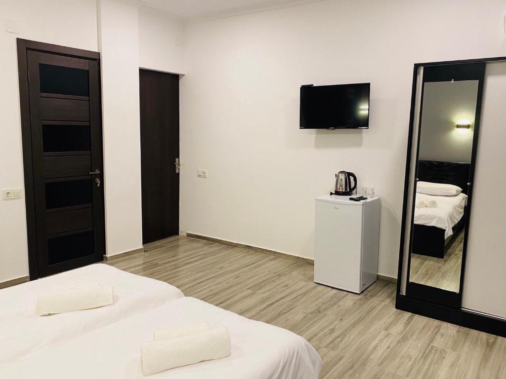 Postel nebo postele na pokoji v ubytování Hotel Niko