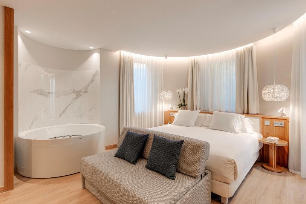 Posteľ alebo postele v izbe v ubytovaní Hotel Boutique Mirlo Barcelona