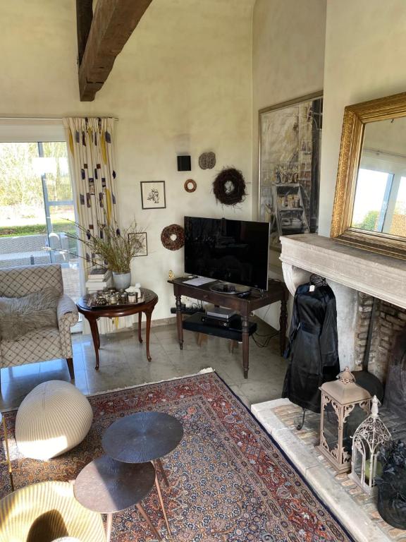 TV a/nebo společenská místnost v ubytování Vakantiewoning Jérôme