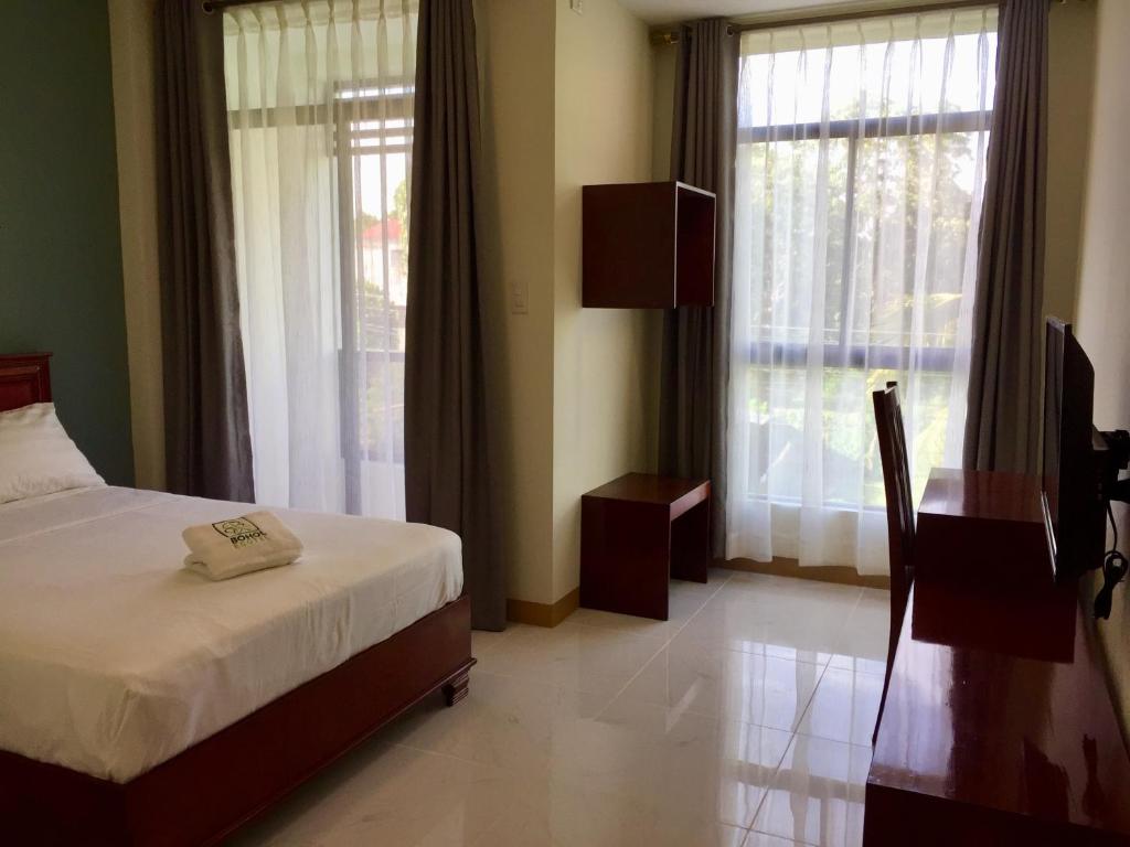 Postel nebo postele na pokoji v ubytování Bohol Ecotel
