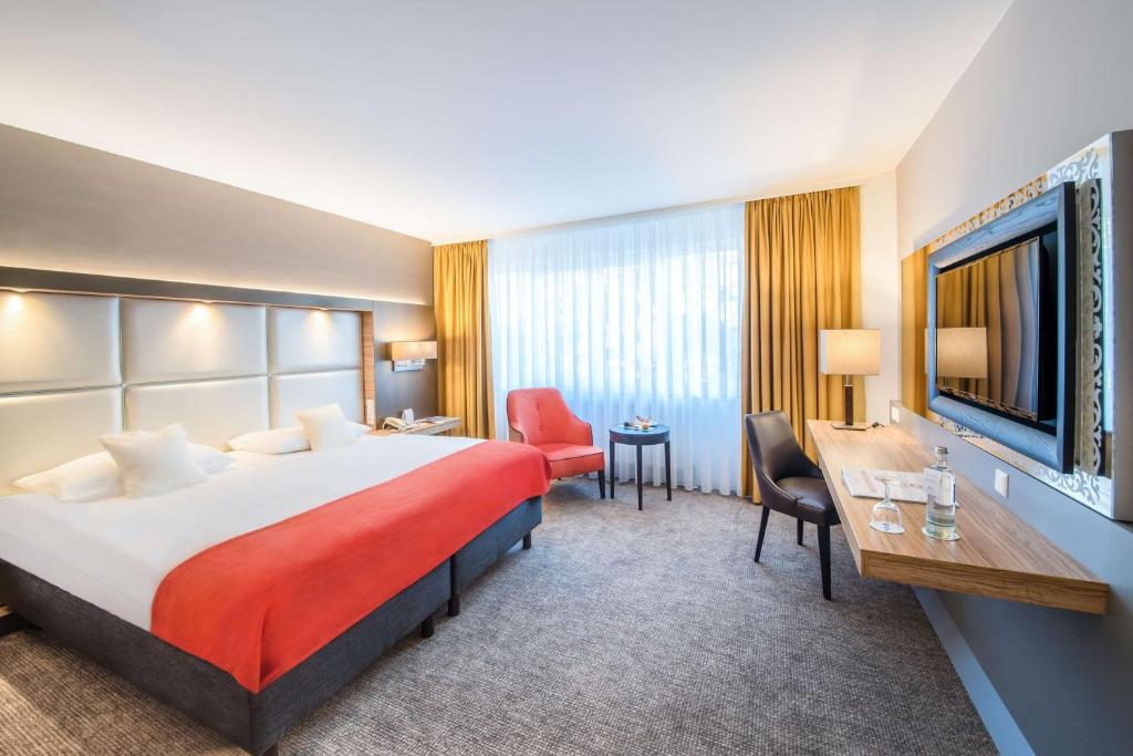 Säng eller sängar i ett rum på Best Western Plus Delta Park Hotel