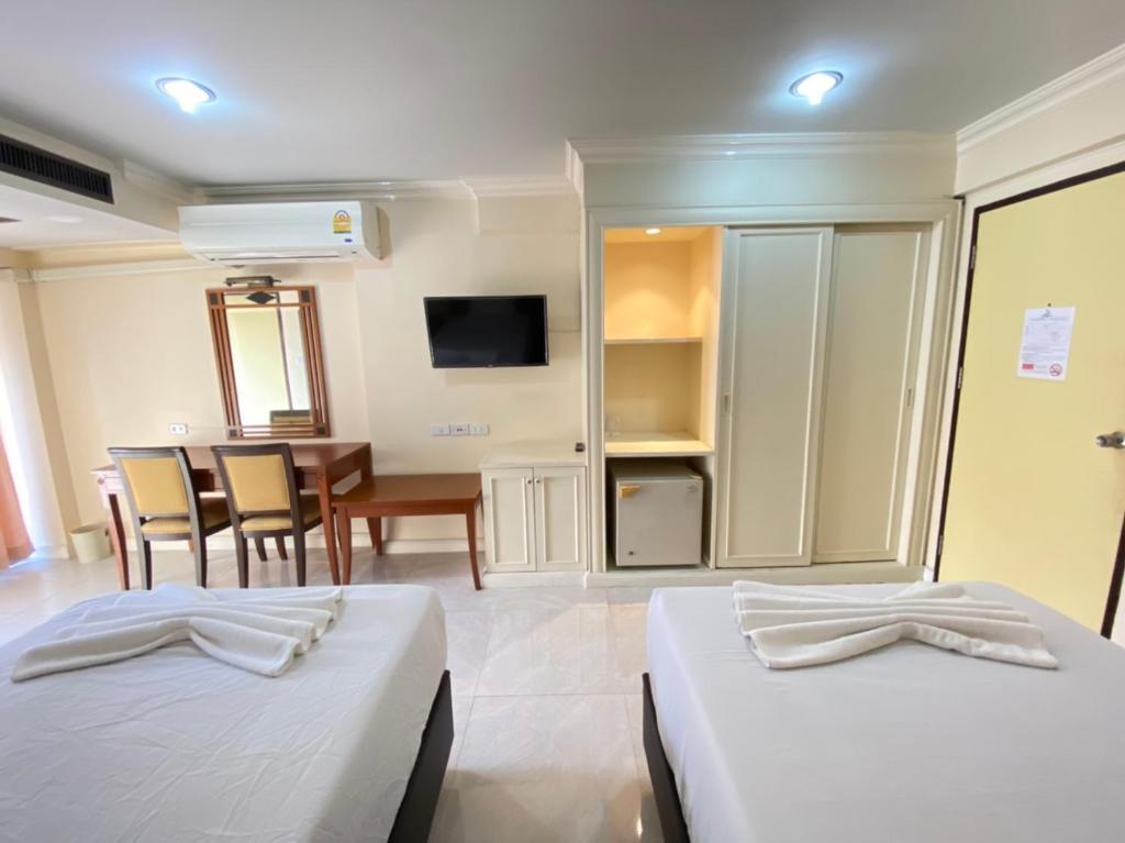 Postel nebo postele na pokoji v ubytování Jumbotel Hotel