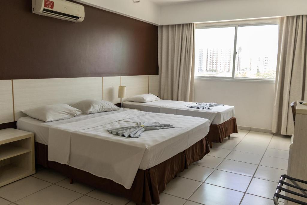 Cama ou camas em um quarto em Apartamento Le Jardin