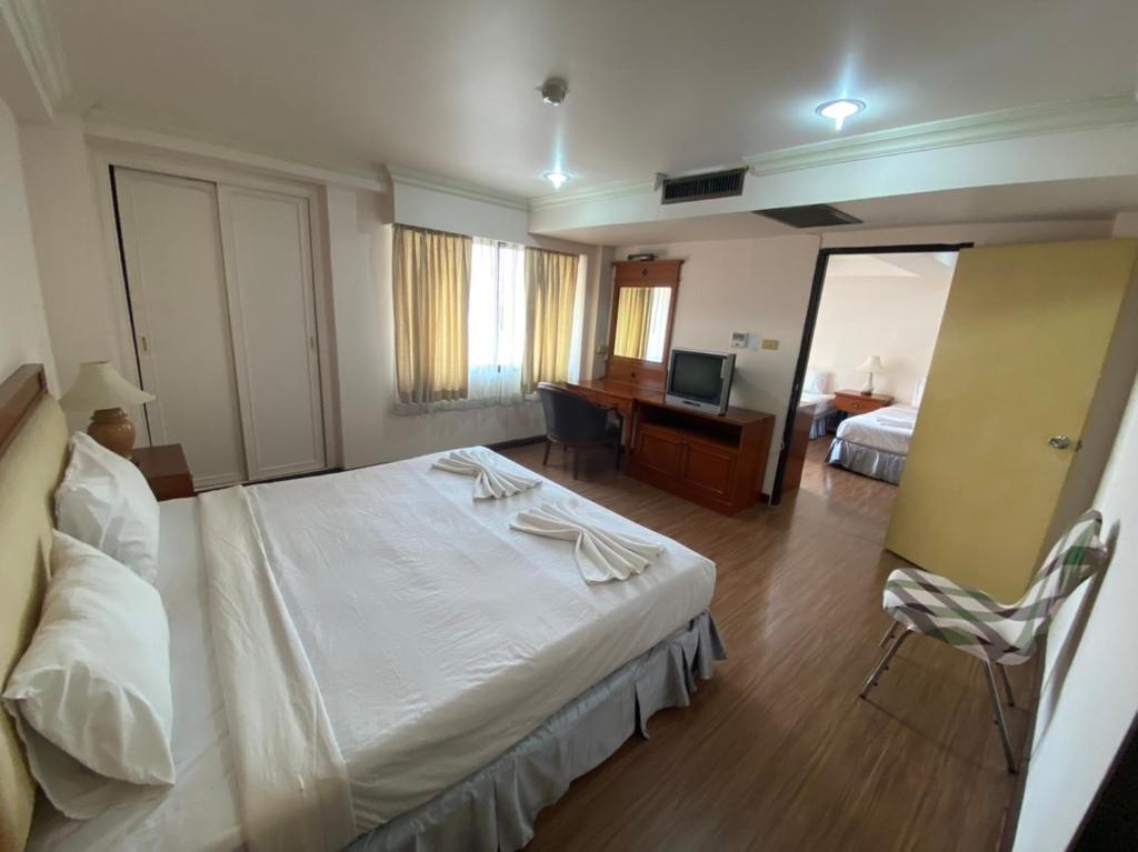 Postel nebo postele na pokoji v ubytování Jumbotel Hotel