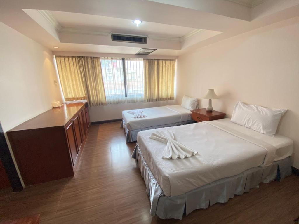 Postel nebo postele na pokoji v ubytování Jumbotel Hotel