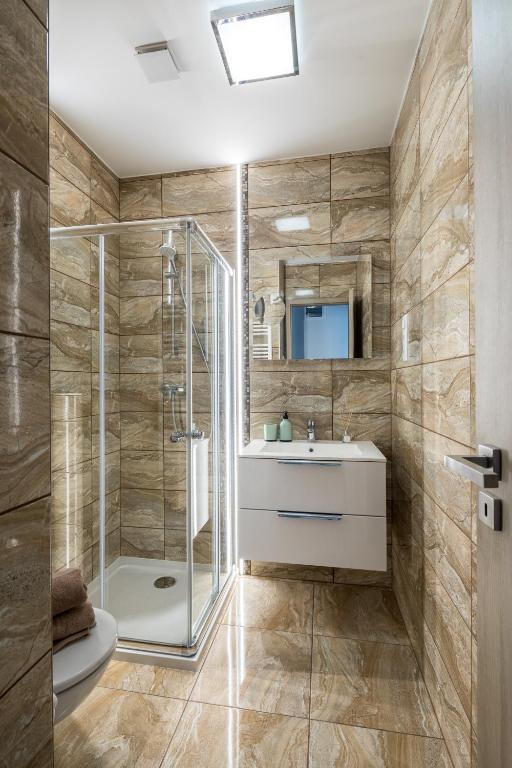 Koupelna v ubytování Stafétaház Apartmanok