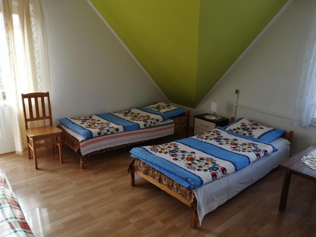 Posteľ alebo postele v izbe v ubytovaní Agroturystyka u Robka