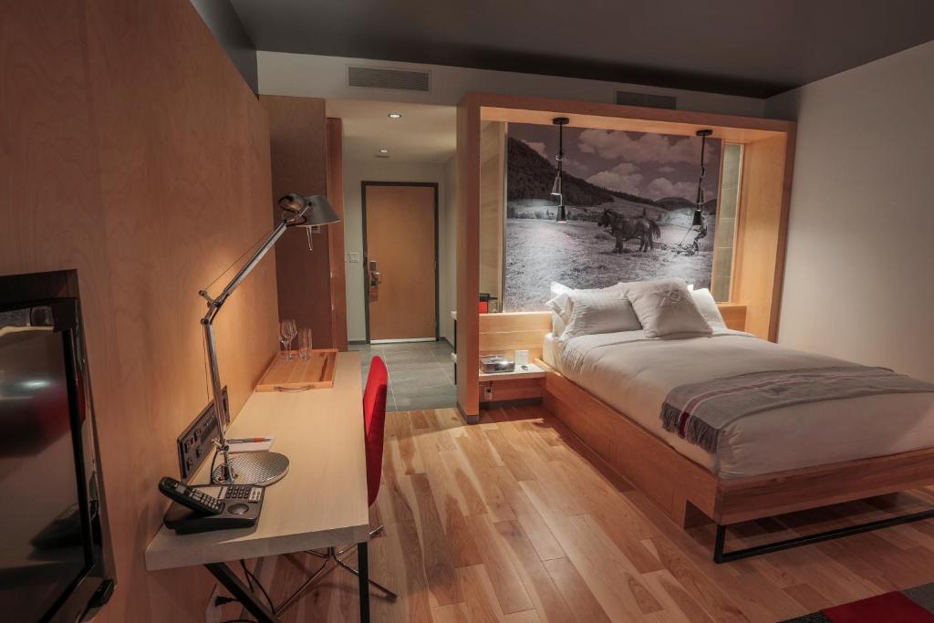 Postel nebo postele na pokoji v ubytování Hôtel & Spa Le Germain Charlevoix