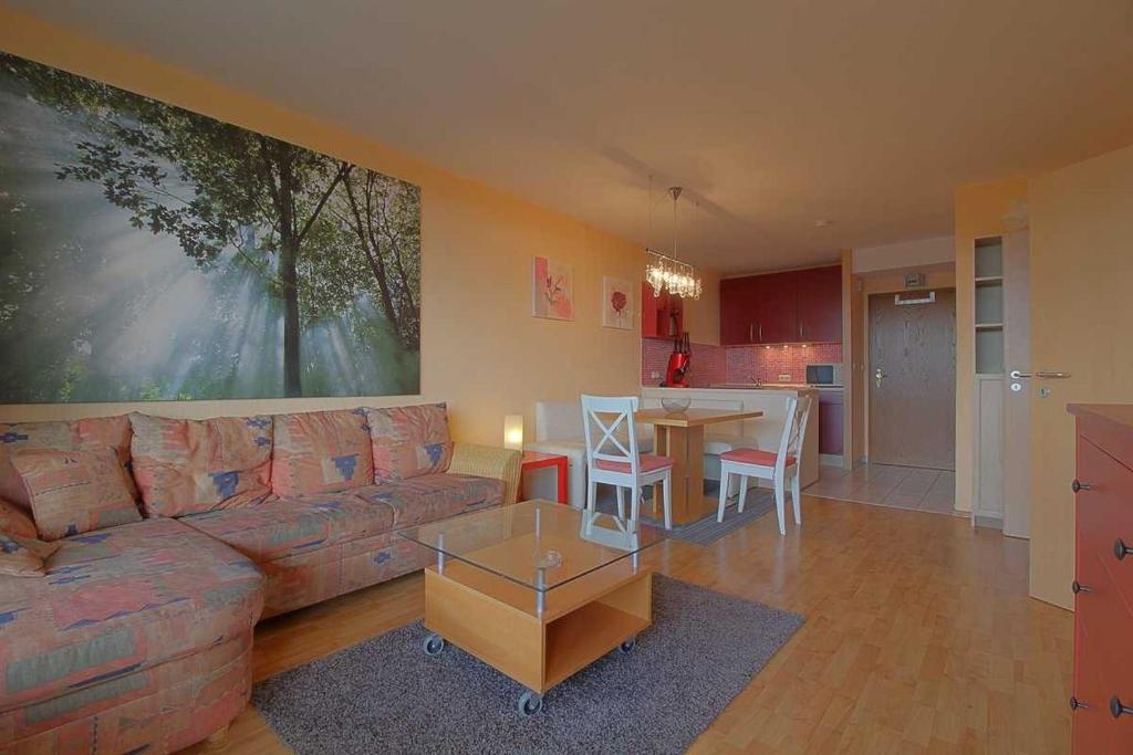 a living room with a couch and a table at Apartment 551 in Hohegeiß