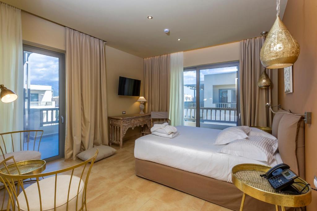 Katil atau katil-katil dalam bilik di Elysian Luxury Hotel and Spa