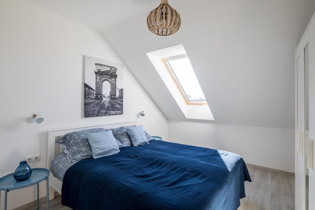 Postel nebo postele na pokoji v ubytování Stafétaház Apartmanok