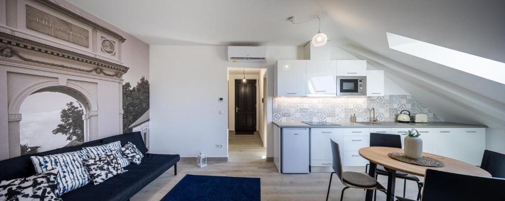 Kuchyň nebo kuchyňský kout v ubytování Stafétaház Apartmanok