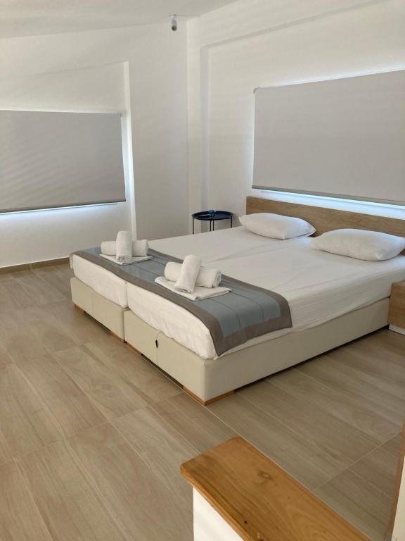 Postel nebo postele na pokoji v ubytování Aristotelia Gi Ikies - Olympiada Poolside Retreats