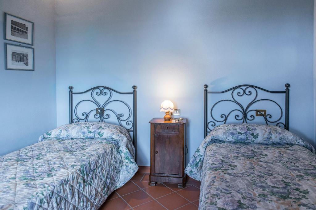 A bed or beds in a room at Casa Torrione 14, Emma Villas