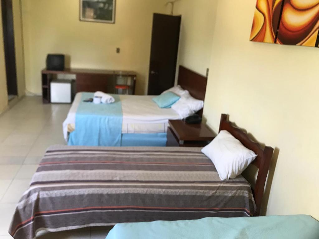 Postel nebo postele na pokoji v ubytování Hotel Viru Viru II