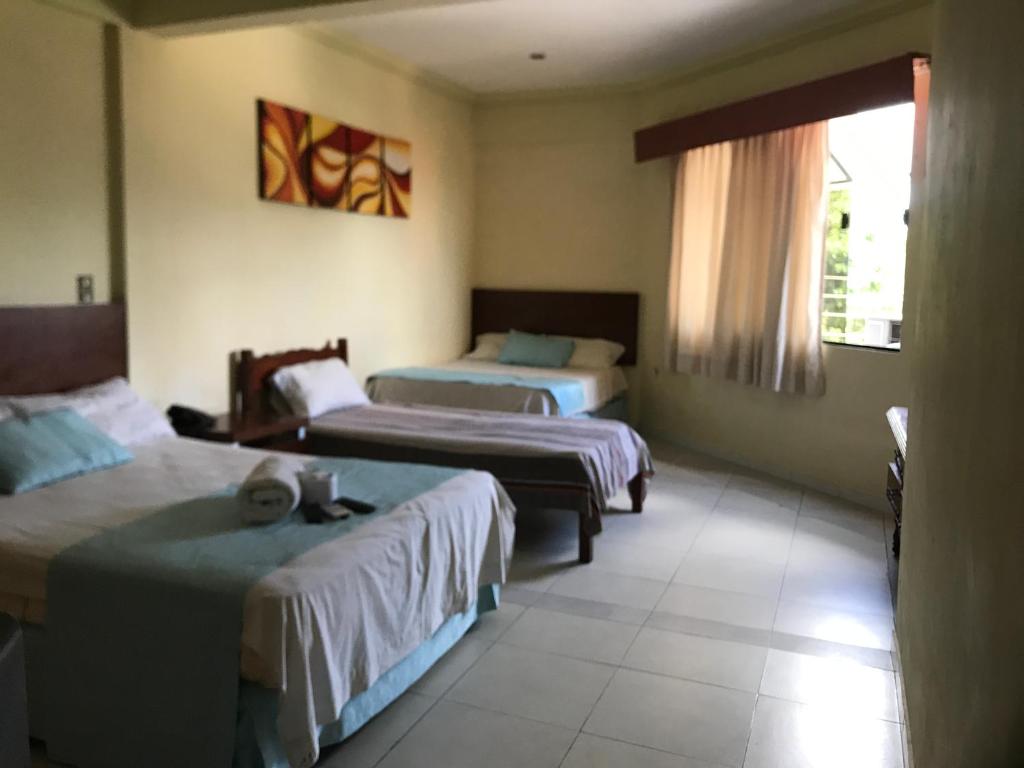 Postel nebo postele na pokoji v ubytování Hotel Viru Viru II