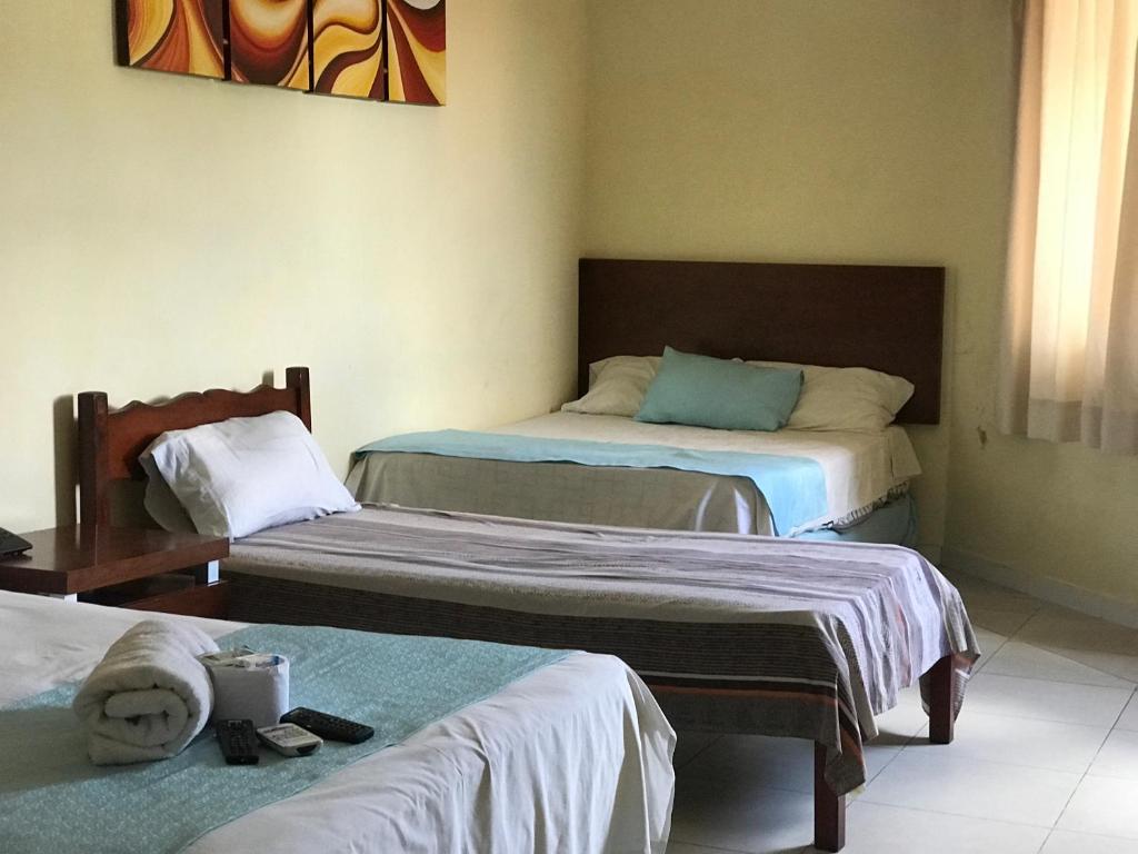 Postel nebo postele na pokoji v ubytování Hotel Viru Viru II