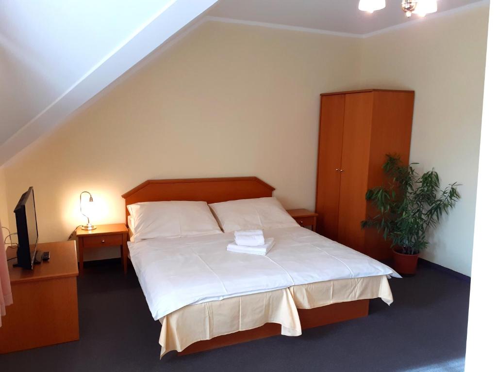 Postel nebo postele na pokoji v ubytování Hotel Casanova