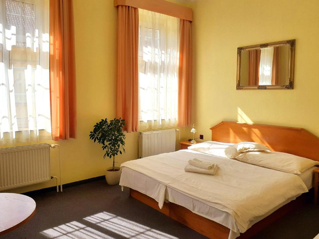 Postel nebo postele na pokoji v ubytování Hotel Casanova
