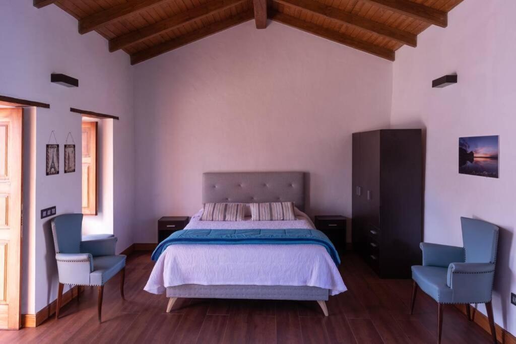 Una cama o camas en una habitación de Casa con encanto