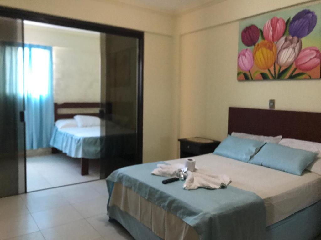 Postel nebo postele na pokoji v ubytování Hotel Viru Viru II