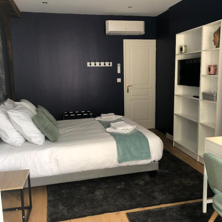 Postel nebo postele na pokoji v ubytování Hotel restaurant LA PLACE