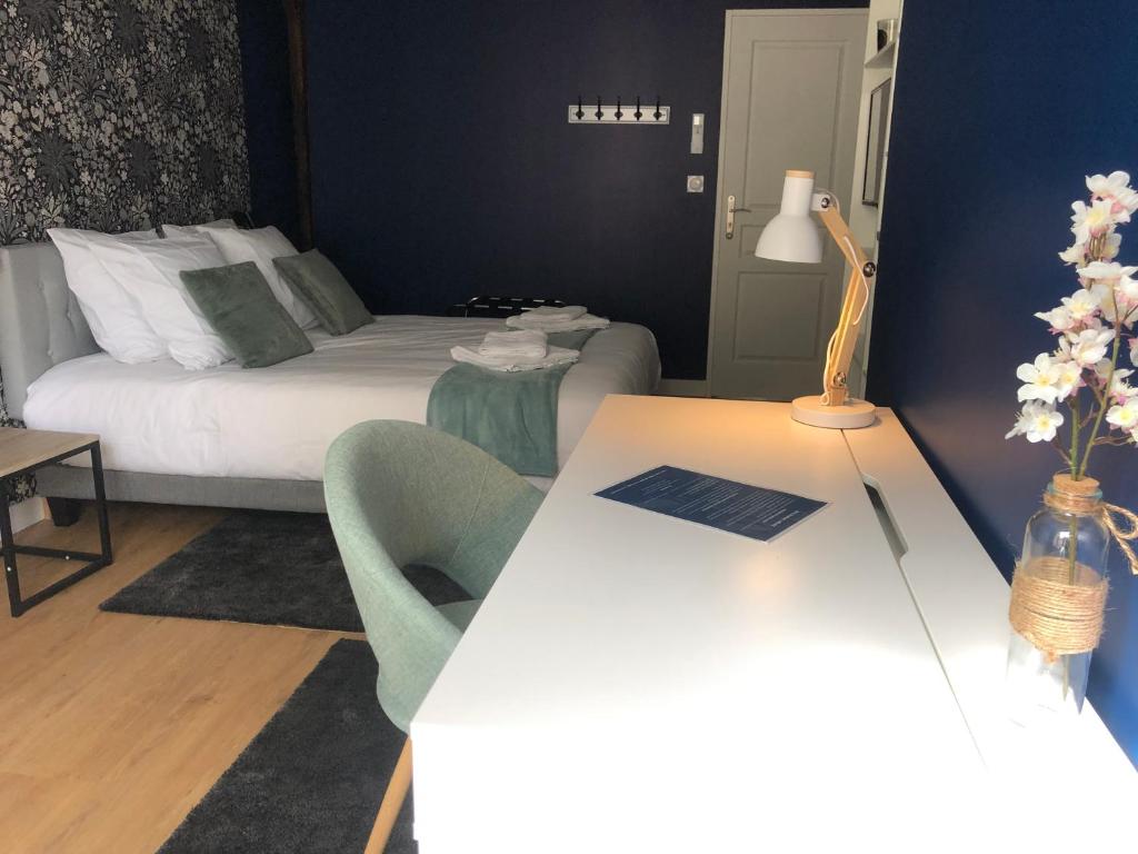Postel nebo postele na pokoji v ubytování Hotel restaurant LA PLACE