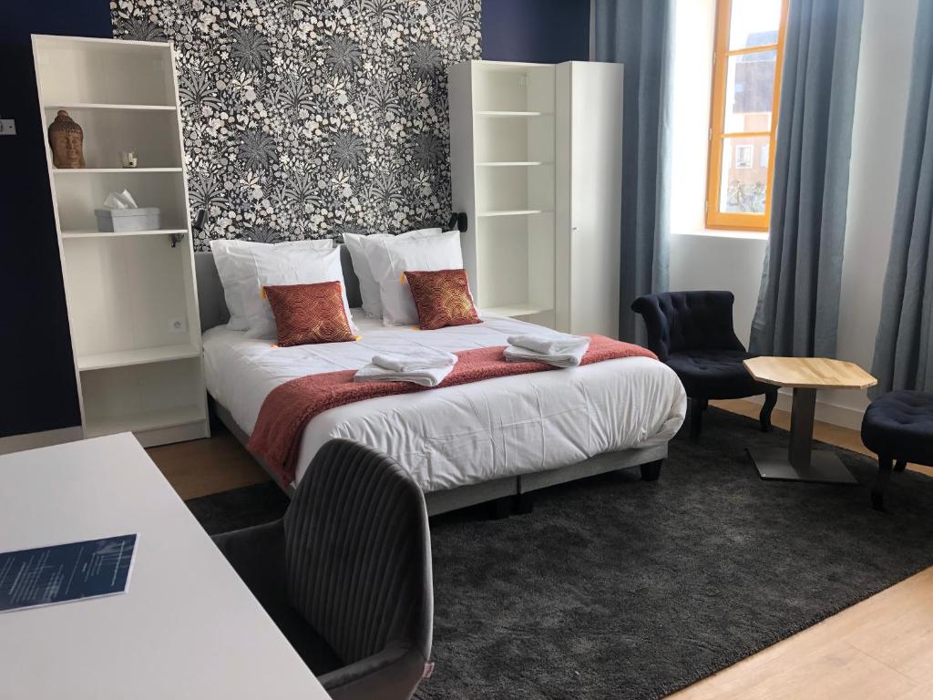 Postel nebo postele na pokoji v ubytování Hotel restaurant LA PLACE