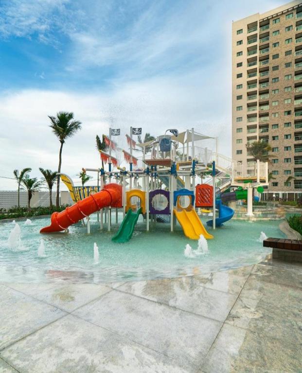 a water park with a slide in the water at Salinas Exclusive Resort in Salinópolis