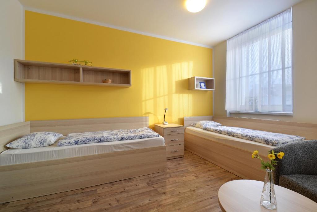 Postel nebo postele na pokoji v ubytování Hotel Palác