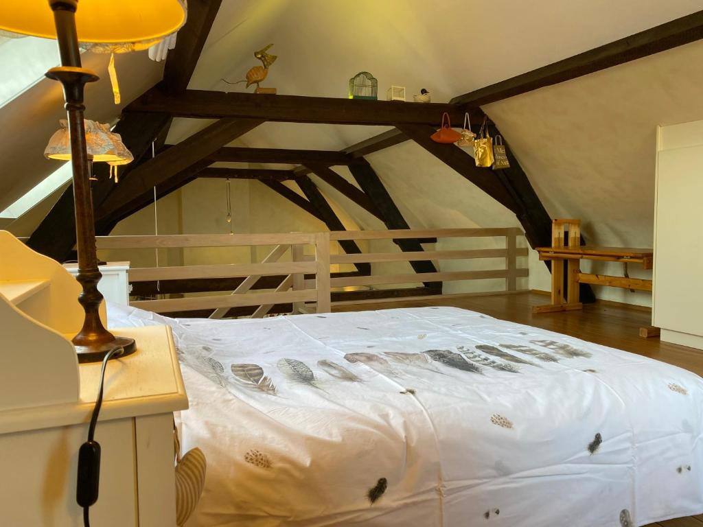 Postel nebo postele na pokoji v ubytování Vakantiewoning Jérôme
