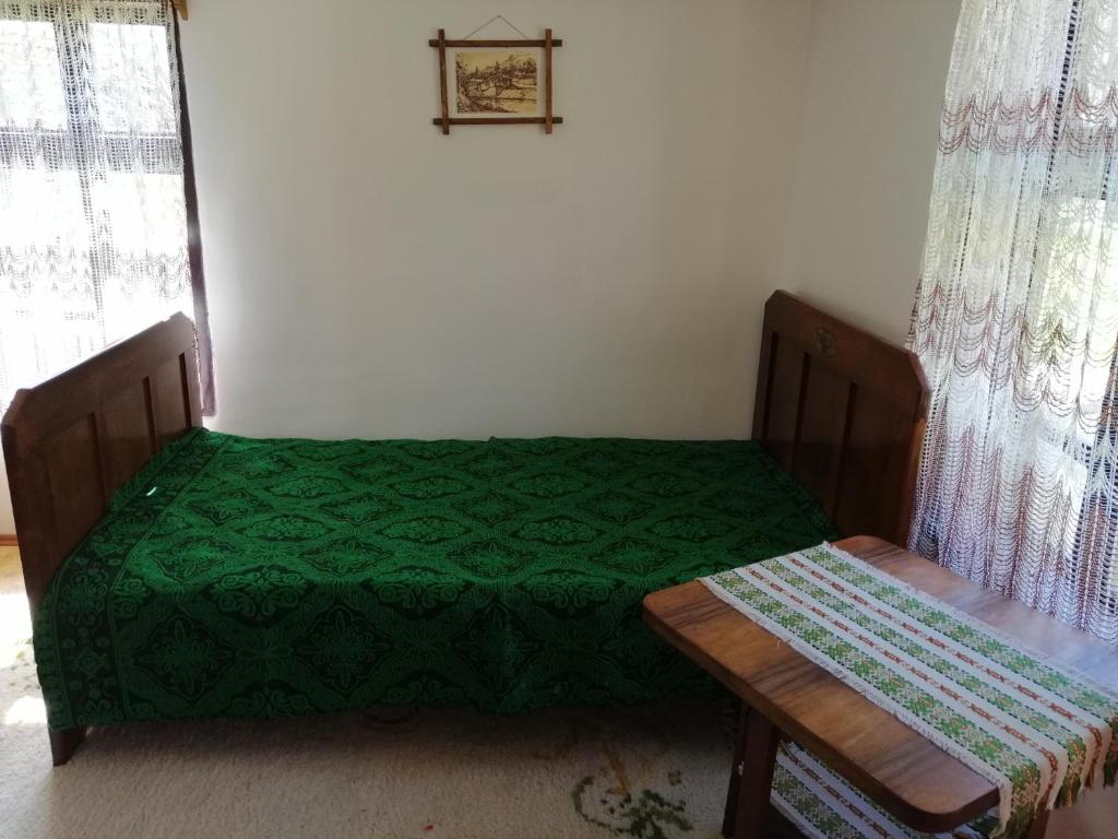 Postel nebo postele na pokoji v ubytování Etno kuca Nikolov