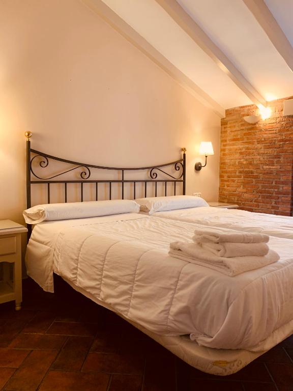 Posteľ alebo postele v izbe v ubytovaní Hotel Plaza Grande