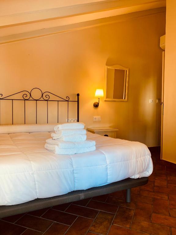 Posteľ alebo postele v izbe v ubytovaní Hotel Plaza Grande