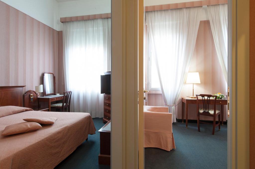 Postel nebo postele na pokoji v ubytování Hotel Esplanade