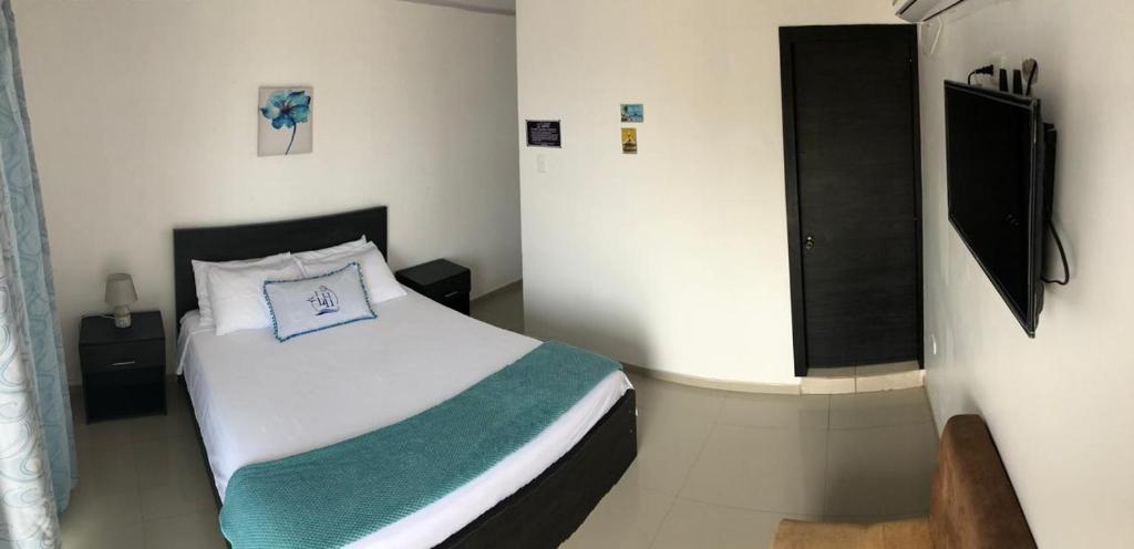 Postel nebo postele na pokoji v ubytování L'Vanna Hotel
