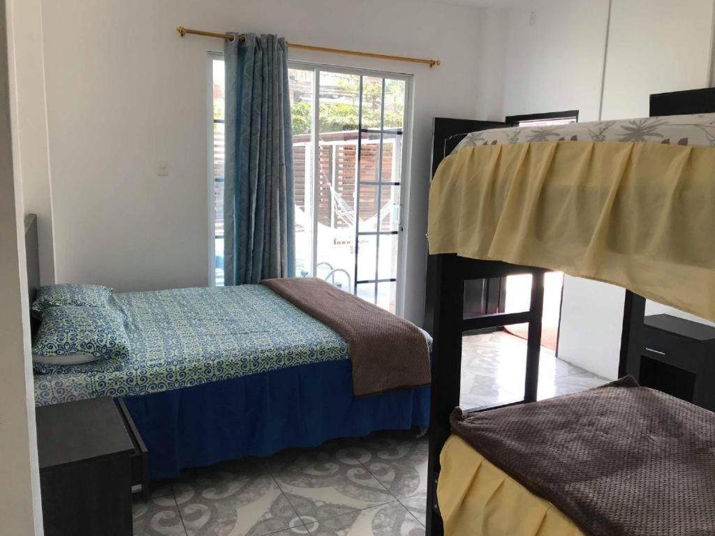 Postel nebo postele na pokoji v ubytování L'Vanna Hotel