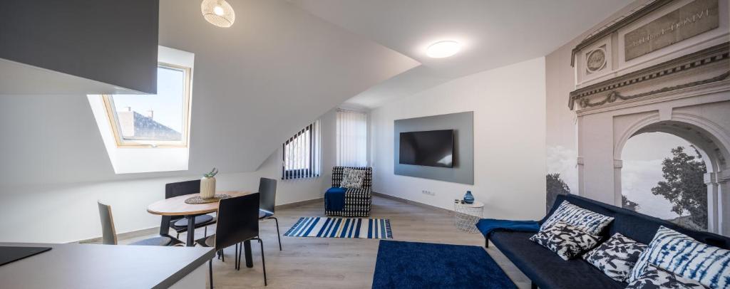 TV a/nebo společenská místnost v ubytování Stafétaház Apartmanok